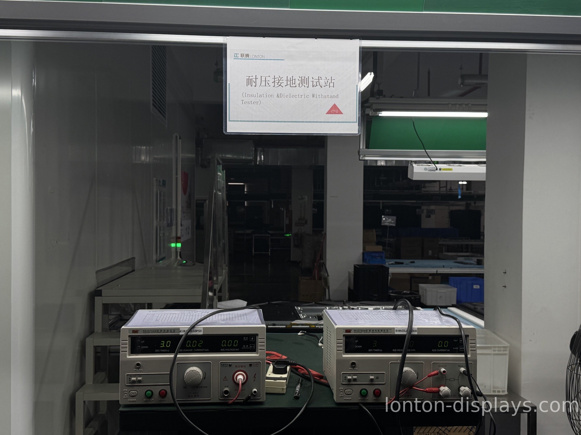 Aging test racks running interactive flat panels before shipping